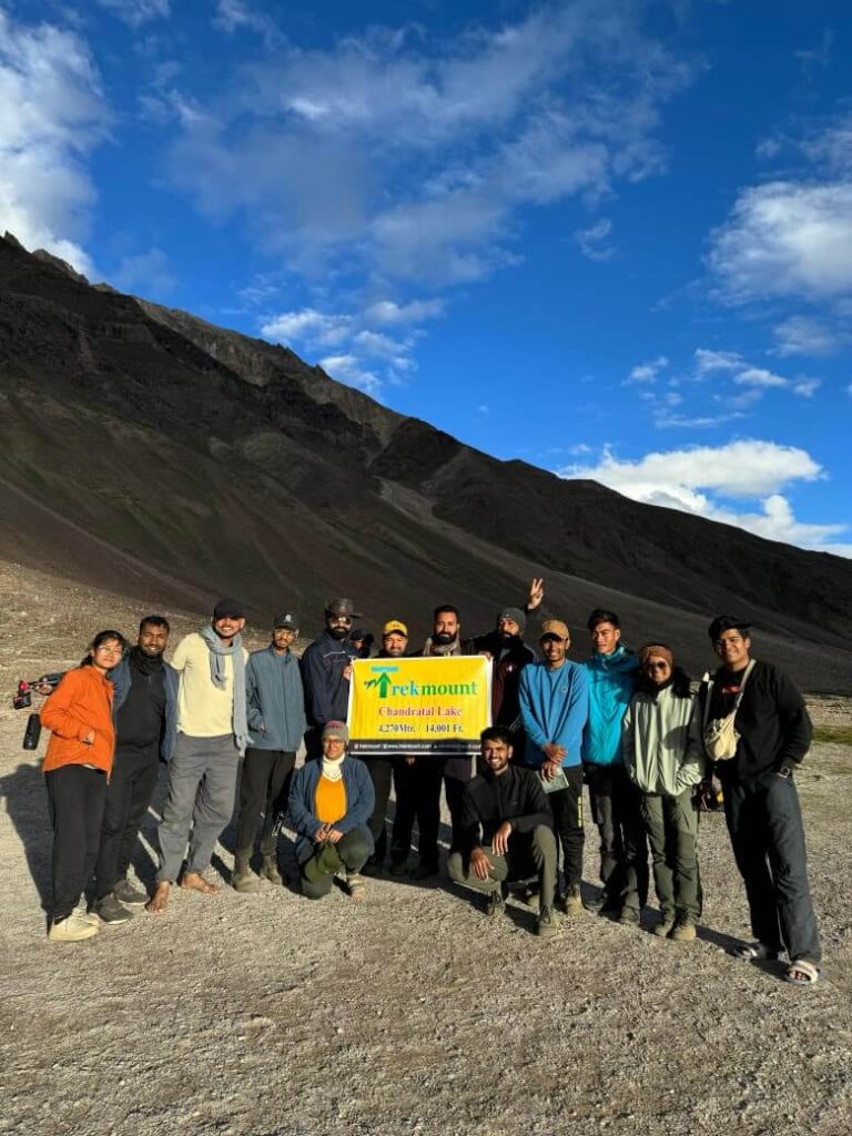 Trekking group at Chandratal Lake during Hampta Pass trek in Himachal